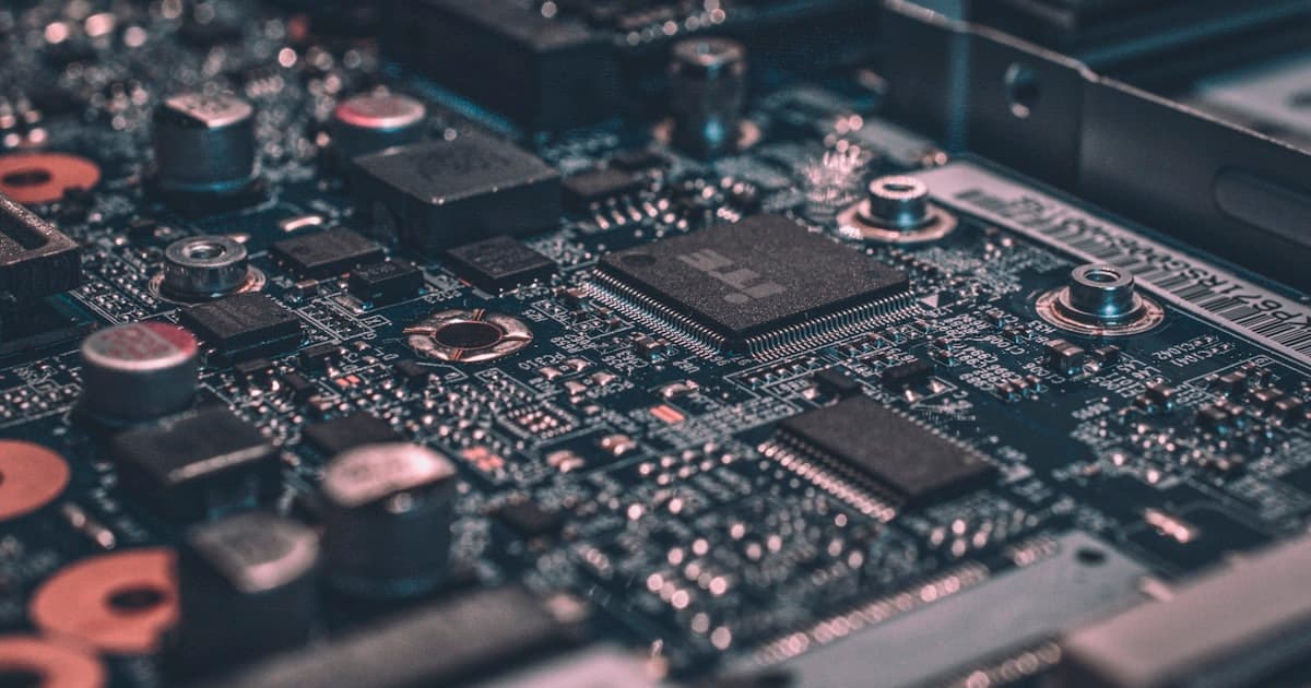 Vintage mainframe computer hardware juxtaposed with modern cloud infrastructure